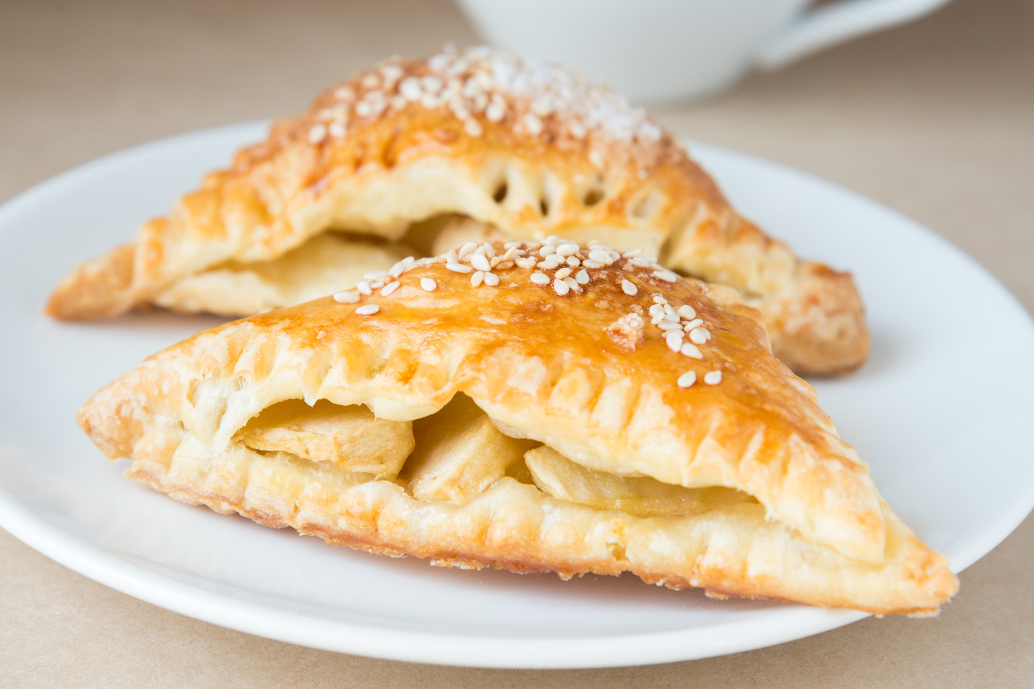 two halves of Apple Turnovers on a plate
