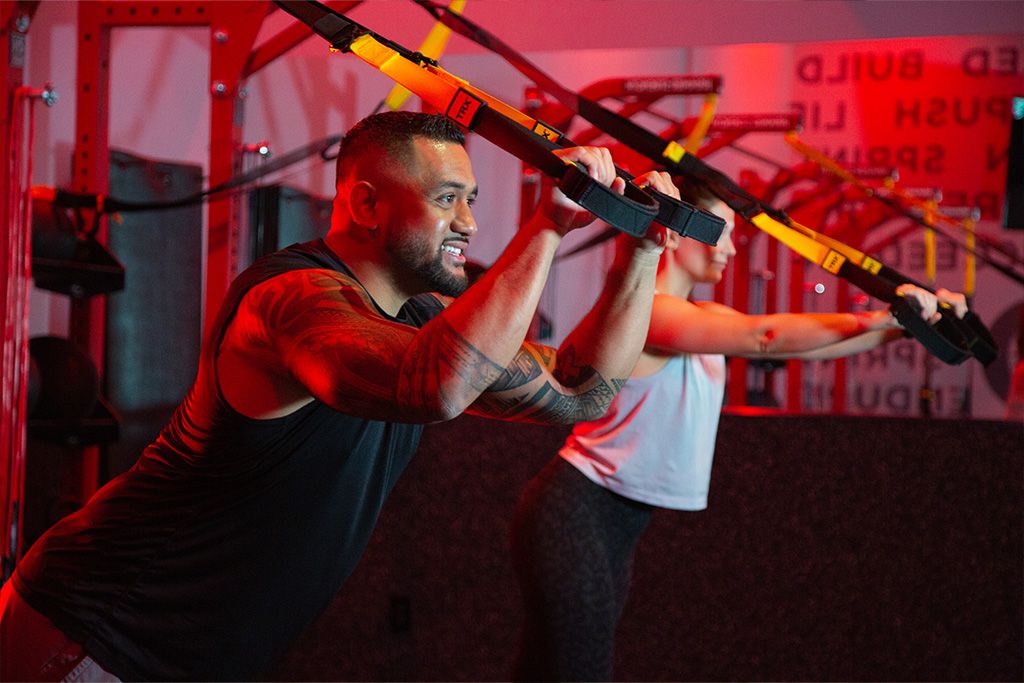 A man and a woman using the Vasa Studio Red to do a beginner cardio workout together