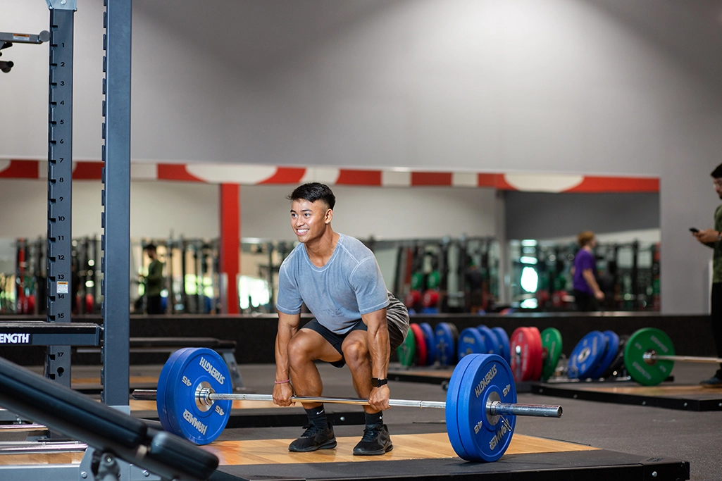 Male athlete deadlifting weights in VASA Fitness Performance Lifting area