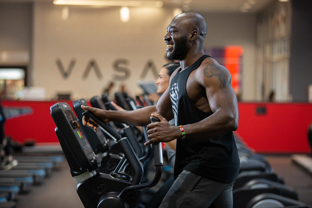 Male athlete running on elliptical at VASA Fitness