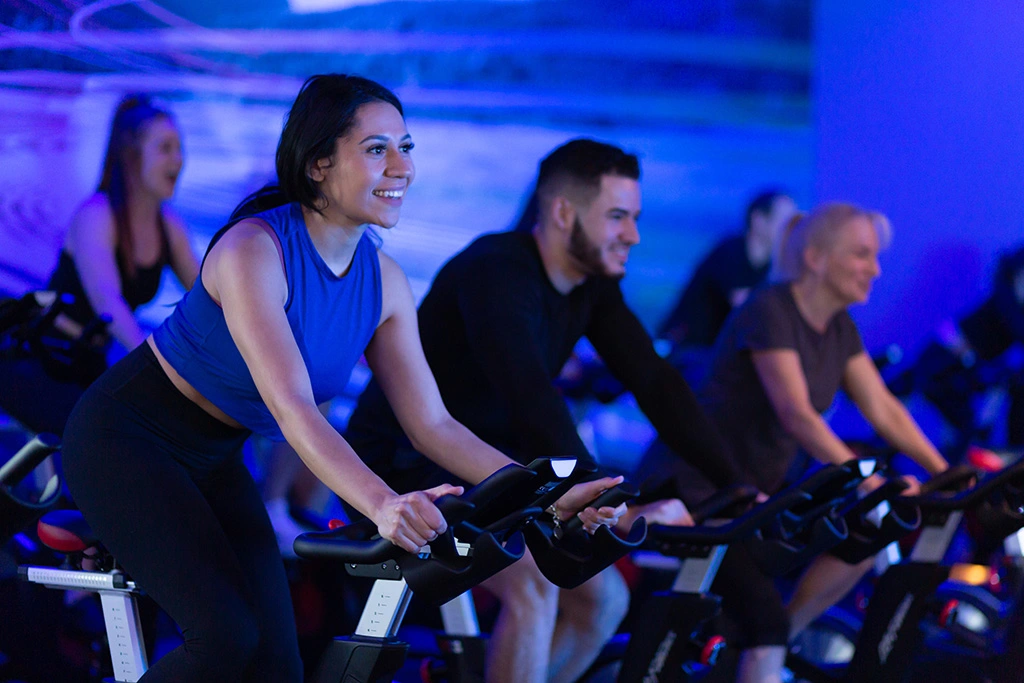 Female athlete on exercise bike in a group class at VASA Fitness