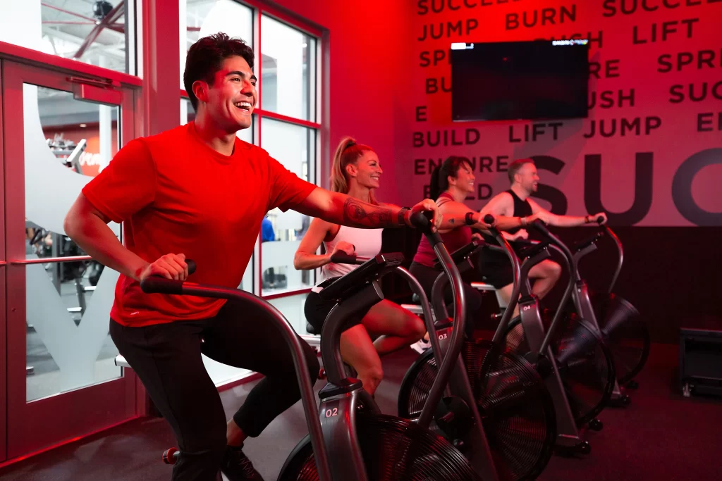 Male athlete on fan bike doing a HIIT workout in STUDIO RED at VASA Fitness