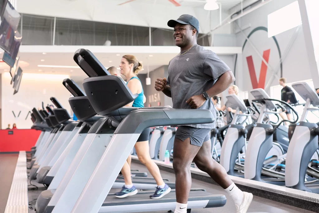 Male athlete running on a treadmill in VASA Fitness Cardio Deck
